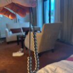 Robbie Williams Instagram - I was gifted some worry beads in the summer. Elegant, with a lovely weight to them. Beads mixed with evil eyes dotted in between. I’d never had worry beads before. I liked how they looked but didn’t know the therapeutic purpose they would serve. Like fidget spinners for the Greek Well to do. Anyway, -as is with ‘’things’’ that I have- I lost them. And I’ve searched to replace them but to no avail. Today I went to ‘House of Beads’ in Zurich, Surely they would have what I am seeking. I wanted to make my own. Alas, The house was full of beads, as advertised, but non the right weight with a hole big enough to thread a thin rope. I googled and it would appear there are no Worry beads for sale in the whole of Zurich. When worry hits Switzerland im gonna be first past the post with my Worry Bead shop. I’m sure it would take off much like the Swatch craze of the late 80’s. Anyway, the last slide is a photo of my worry beads, The rope is Fine, The weight is perfect but there is something very manly about the metal balls. Something that isn’t quite ‘’otherworldly’’ it’s more ‘’Swarfega’’.And I wanna feel ‘’Mystical’’ more than I wanna feel a ’Carburetor’’ Any of you guys know where I can procure a nicely weighted set of worry beads? The ones that I keep coming across are too lightweight and feel a bit like what you would win if you were victorious in your Christmas Cracker fight. If not, No worries I.Epicurus Namaste `🙏❤️