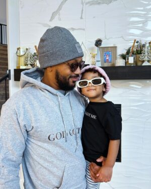 Romeo Miller Instagram - Just at the crib trying on the new @romeeverything threads for the relaunch this holiday season and my little River Rose saw the baby gear and dressed up like daddy, went and grabbed her shades and crashed the party and never left my side. Guess I found my new R|E model lol. Man I love being a girl dad! 🥹😎🤍💕 #GodGotMe #RomeEverything #LinkinBio #GirlDad #Twin