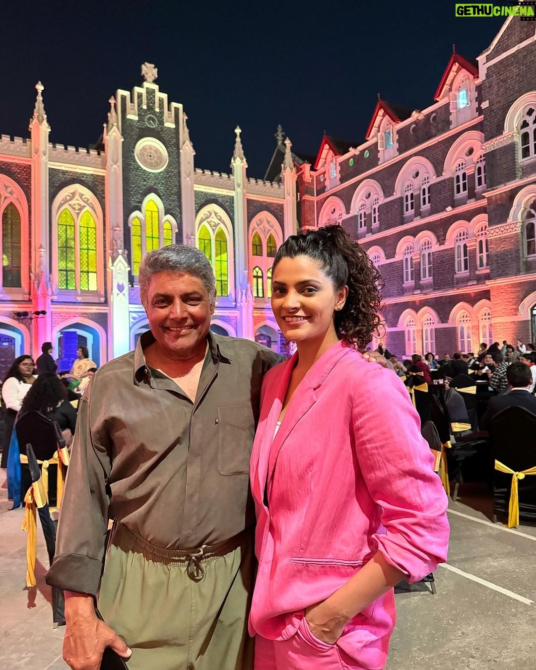 Saiyami Kher - 29.2K Likes - For every little girl her first hero is always her father. I was no different. He loved his college. Xaviers not only looked like Hogwarts but it felt magically listening to my father describe it. So studying at Xaviers was always a dream. 82% was never going to be enough to get me admission there. But sport & my sister came to my rescue. My state level badminton certificates attested, my sister stood in queue & lo behold my name was on the sports quota list at St. Xaviers college. My proud father drove me from Nasik for my investiture ceremony. He couldn’t contain his excitement. The moment I stepped into Xaviers I realised why. My father took me along showing me his class & the terrace, like he was showing me his childhood house. I immediately felt at home.
I didn’t realise how much this college was moulding me into what I am. I spent the 5 best years of my life having fun. Malhar security,playing 9 sports, soaking in the music theatre & in between this studying. I learnt how to dream, to live, to love to fight for what is right, to become a better person. Xavier’s was not a college it was a way of life.
When I passed out,I immediately started modelling & auditioning for films. I realised how the world outside is not Xaviers, its not such a happy place. People are not kind, life is not fair & the struggle is real. But my professors had prepared me well. My friends have been my support system everytime I have been down. So for me making my family,friends & teachers proud always remains my first goal.
A few days ago I was called to college where they felicitated me for Ghoomer. This time around I drove my father from Nasik. My professors met me with their eyes filled with pride. My father took me around again showing me same the class & the same terrace, this time it took longer, I had to share my memories as well. He watched me go up on stage, heard all the kind words of praise & couldn’t contain his excitement, with tears flowing down his cheeks. My first hero was very proud of me. I hope I can continue to make him, my family, friends & teachers feel proud. I have a long long way to go, but this part of my life, this little part, is called HAPPINESS ❤️