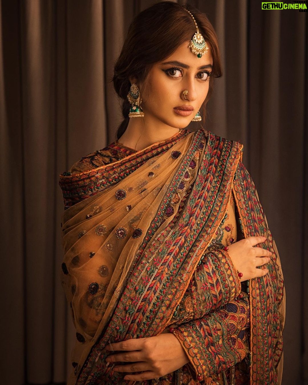 Sajal Ali Instagram - Apni roshni kay saaye talay, meri tarha tum bhi parhti jao, nikharti jao, sanwarti jao 🌸💫✨ Brand: @theworldofhsy Exclusively available at @laamofficial Photography: @shahbazshaziofficial Videography: @nusairrahman.photography Set: @saadamjed16 Hair & Makeup: @nabila_salon Stylist: @khojiiii Script: @rameez_haider Creative Director: @hassanhsy Exclusively available online at www.theworldofhsy.com and www.laam.pk from the 8th of March! #HSY #HSYxLAAM #LAAM #TheRehanaCollection #RehanabyHSY #celebratingwomenofsubstance #eidcollection #affordableluxury #fashion #love #sajalaly #SAJALxHSY