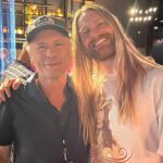 Sam Ryder Instagram - Lived out my childhood dream of chatting to @martinbrundlef1 on the grid wearing an @ironmaiden shirt I got from their show the night before 🤘 Loads of memories camping at @silverstonecircuit with the fam in my Dad’s work van watching the race from our camping chairs 🙏Such a privilege to see the action up close 🏎 Can’t say I have the same history with tennis but I’m absolutely HOOKED now! Big to my fabulous pal @hannah_waddingham for giving me a MasterClass crash course at @wimbledon 🎾 @billyjoel the goal remains to sing my head off with you but joining in with 60,000 other devoted maniacs will more than do for now 💛