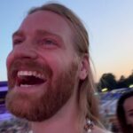 Sam Ryder Instagram - Lived out my childhood dream of chatting to @martinbrundlef1 on the grid wearing an @ironmaiden shirt I got from their show the night before 🤘 Loads of memories camping at @silverstonecircuit with the fam in my Dad’s work van watching the race from our camping chairs 🙏Such a privilege to see the action up close 🏎 Can’t say I have the same history with tennis but I’m absolutely HOOKED now! Big to my fabulous pal @hannah_waddingham for giving me a MasterClass crash course at @wimbledon 🎾 @billyjoel the goal remains to sing my head off with you but joining in with 60,000 other devoted maniacs will more than do for now 💛