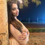 Sanjjanaa Instagram - This maternity friendly gold beautiful dress from India's number one maternity brand, @momzjoy , is truly stunning and looks absolutely stunning on me ! This dress has been specifically designed to cater to the needs of pregnant women & also goes very well on voluptuous woman like me, ensuring both comfort and style . the dress is designed with a maternity-friendly silhouette. It takes into consideration the changes that occur in a woman's body during pregnancy, such as a growing belly and fluctuating bust size. The dress provides ample room for your bump to grow comfortably, allowing you to move freely without any constraints and also most importantly, it is feeding friendly once your infant arrives. Additionally, the fabric used in this dress is carefully selected to ensure utmost comfort. It is soft, breathable, and stretchy, providing a gentle embrace to our changing body . The design of the dress is both fashionable and functional. It may feature a wrap-style front, or an empire waistline, all of which accentuate to woman’s beautiful curves and create a flattering silhouette. The dress may also include discreet nursing access, allowing you to breastfeed your baby conveniently while maintaining your style. As India's number one maternity brand, Momzjoy prioritizes the needs and desires of pregnant women, ensuring that their clothing not only meets the highest quality standards but also reflects the latest fashion trends. Their attention to detail and commitment to creating maternity-friendly designs is evident in this gold beautiful dress. Overall, this maternity dress from Momzjoy is a perfect choice, combining the elegance of gold with the comfort and functionality required during pregnancy. You can confidently wear this dress for various occasions, whether it's a special event, a party, or a casual outing, knowing that you look absolutely stunning and feel comfortable at the same time. - @sanjjanaagalrani Karnataka, Bangalore