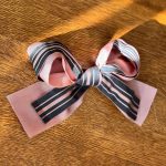 Sarah Jessica Parker Instagram - The bow that started it all. When I saw how madly in love everyone was with this bow (as was I), a last minute detail thrown together by me and @sergenormant just minutes before leaving for the annual @nycballet Fall Gala, I immediately set out on a mission: searching for and sourcing the finest grosgrain, taffeta and satin ribbons. In many cases the vintage I was hoping still existed and could unearth.  From hidden corners of New York City, to unique and interesting places far far away, I've found some really special and insanely beautiful ones. And with that, I introduce you to: the @sjpcollection Gala Bow. From Petite to Grand in length, I hand picked every single ribbon - some almost 100 years old! - and crafted a collection that I’m quite proud of. Our Gala Bows come with a sturdy 3-inch flat hair pin making it easy to affix however your heart desires. Most importantly, each bow was sewed with love. And you can be assured that I’ll be personally steaming, boxing up, and shipping out every single Gala Bow order that comes in. I can’t wait to see how you wear these. Link to shop is in my bio. X, SJ PS. For those concerned, that bow is simply rested on Lotus. Not tied!