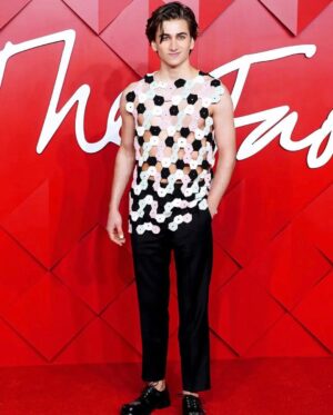 Sebastian Croft Instagram - inspiring evening at the British Fashion Awards, thank you @vestiaireco for having me. 

wearing an archive @jonathan.anderson top from his first solo menswear show, burberry trousers and @stefan_cooke shoes. All found via @vestiaireco 
Jewlery @cartier ✨

Tilda Swinton speaks in some kind of magical poetry. I’m completely in awe of her 
 
Styled by @harry_lambert 
Grooming @svenbayerbach 
Nails by @simmy_nailsandbeauty