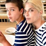 Selma Blair Instagram - My Saint, Arthur, happy birthday 🎂. This has been the most incredible life with you. Forever my favorite, I know you are going to have the best year yet. I am so proud of who you are and have become. Usually 🦁. The most adorable little kid has grown into a 12 year old!!!! 🐣🦅. I love you and I like you. Massively. 💛 mom Image descriptions: 1. A younger Arthur sits inside a brown handbag next to Selma while both look at the camera. They are poolside. 2. A 12-year old Arthur with short hair sitting on his motorbike and looking at camera. 3. Selma and Arthur wearing blue and white striped shirts sitting next to each other and looking at camera. 4. Arthur and Jason are on a boat with the sun and ocean behind them. They are smiling and looking at camera. 5. Selma, Arthur, and her dog Scout laying in bed. 6. Arthur in a striped sweater cuddles their dog Pippa. 7. An older photo of Selma and Arthur. Selma has long hair and they are smiling at the camera. 8. Selma and Arthur sit in bed. Selma is looking at Arthur and Arthur is looking into the distance. 9. Arthur in a blue shirt and short hair cuddles their dog Scout. 10. A younger Arthur with wild hair holding a guitar and smiling at camera.
