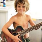 Selma Blair Instagram - My Saint, Arthur, happy birthday 🎂. This has been the most incredible life with you. Forever my favorite, I know you are going to have the best year yet. I am so proud of who you are and have become. Usually 🦁. The most adorable little kid has grown into a 12 year old!!!! 🐣🦅. I love you and I like you. Massively. 💛 mom Image descriptions: 1. A younger Arthur sits inside a brown handbag next to Selma while both look at the camera. They are poolside. 2. A 12-year old Arthur with short hair sitting on his motorbike and looking at camera. 3. Selma and Arthur wearing blue and white striped shirts sitting next to each other and looking at camera. 4. Arthur and Jason are on a boat with the sun and ocean behind them. They are smiling and looking at camera. 5. Selma, Arthur, and her dog Scout laying in bed. 6. Arthur in a striped sweater cuddles their dog Pippa. 7. An older photo of Selma and Arthur. Selma has long hair and they are smiling at the camera. 8. Selma and Arthur sit in bed. Selma is looking at Arthur and Arthur is looking into the distance. 9. Arthur in a blue shirt and short hair cuddles their dog Scout. 10. A younger Arthur with wild hair holding a guitar and smiling at camera.