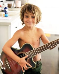 Selma Blair Instagram - My Saint, Arthur, happy birthday 🎂. This has been the most incredible life with you. Forever my favorite, I know you are going to have the best year yet. I am so proud of who you are and have become. Usually 🦁. The most adorable little kid has grown into a 12 year old!!!! 🐣🦅. I love you and I like you. Massively. 💛 mom Image descriptions: 1. A younger Arthur sits inside a brown handbag next to Selma while both look at the camera. They are poolside. 2. A 12-year old Arthur with short hair sitting on his motorbike and looking at camera. 3. Selma and Arthur wearing blue and white striped shirts sitting next to each other and looking at camera. 4. Arthur and Jason are on a boat with the sun and ocean behind them. They are smiling and looking at camera. 5. Selma, Arthur, and her dog Scout laying in bed. 6. Arthur in a striped sweater cuddles their dog Pippa. 7. An older photo of Selma and Arthur. Selma has long hair and they are smiling at the camera. 8. Selma and Arthur sit in bed. Selma is looking at Arthur and Arthur is looking into the distance. 9. Arthur in a blue shirt and short hair cuddles their dog Scout. 10. A younger Arthur with wild hair holding a guitar and smiling at camera.