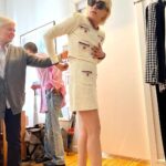 Selma Blair Instagram - You are my slay of the day every day @hodakotb and @jennabhager ! Thank you for having me on @hodaandjenna to talk Mean Baby! 📖💗 Image Descriptions: Image 1: Selma has short blonde hair and is standing on the left in a cream jacket and skirt. Hoda is in the middle in a yellow jacket with her arm around Selma. Jenna is on the right holding a cup of coffee wearing an orange skirt and top. Image 2: Selma getting her makeup touched up by Frankie. Selma is wearing a white robe with clips in her hair. Rita is in the background of the two. Image 3: Selma stands with Kate Young. Selma is wearing a striped shirt and jeans. Kate wears a grey sweater and black pants. Image 4: Selma stands in a matching cream skirt set, sunglasses, and black heels. Kate young is adjusting her outfit. Video: Selma walking into set with her dog, Scout. Selma greets Hoda and Jenna with hugs. Image 5: Selma sits in her robe and smiles to the camera.
