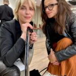Selma Blair Instagram - London 🖤. It was time. We love you. I only wish I could stay longer. This time in London has been so good for my northern soul. And my son was enchanted as well. We met our dearest friends. Been too long. and I’m changed. Thank you Image descriptions: Image 1: Selma has short blonde hair and is standing with the London skyline behind her. Image 2: Selma and Arthur sit in separate chairs. Arthur has short brown hair and sitting on the left in a chair in a hotel lobby with black and white floor. Image 3: Silhouette of Selma holding her cane with a long coat on. Image 4: Arthur is on left wearing black jacket with a hoodie, hugging Stella, who is wearing long sleeve grey shirt. Image 5: Selma and Arthur walking to music that Stella, whose back is to the camera, plays on her phone. Image 6: Selma is standing with her cane next to Vanessa Kingori who is on the left wearing a light green outfit with her arm around Selma. Image 7: Selma is wearing a grey suit and holds her cane. She is standing outside, surrounded by lit up trees. Image 8: Selma is on the left kneeling with her cane in front of her next to Katie who has brown hair and is wearing glasses and wearing white boots. Image 9: Black and white photo of Selma with Anya Taylor Joy, who has long, straight blonde hair. Image 10: Video of Selma and Arthur walking on the street in London. London, England