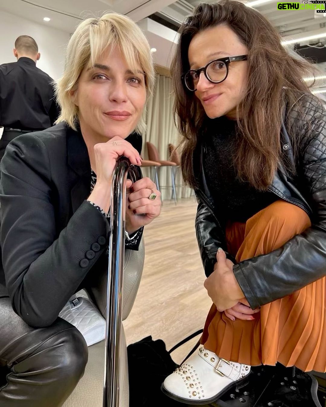 Selma Blair Instagram - London 🖤. It was time. We love you. I only wish I could stay longer. This time in London has been so good for my northern soul. And my son was enchanted as well. We met our dearest friends. Been too long. and I’m changed. Thank you Image descriptions: Image 1: Selma has short blonde hair and is standing with the London skyline behind her. Image 2: Selma and Arthur sit in separate chairs. Arthur has short brown hair and sitting on the left in a chair in a hotel lobby with black and white floor. Image 3: Silhouette of Selma holding her cane with a long coat on. Image 4: Arthur is on left wearing black jacket with a hoodie, hugging Stella, who is wearing long sleeve grey shirt. Image 5: Selma and Arthur walking to music that Stella, whose back is to the camera, plays on her phone. Image 6: Selma is standing with her cane next to Vanessa Kingori who is on the left wearing a light green outfit with her arm around Selma. Image 7: Selma is wearing a grey suit and holds her cane. She is standing outside, surrounded by lit up trees. Image 8: Selma is on the left kneeling with her cane in front of her next to Katie who has brown hair and is wearing glasses and wearing white boots. Image 9: Black and white photo of Selma with Anya Taylor Joy, who has long, straight blonde hair. Image 10: Video of Selma and Arthur walking on the street in London. London, England