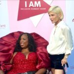 Selma Blair Instagram - It was a joy to join forces with my dear @andraealavant and her passionate team at @lavantconsulting for the first ever I AM Inclusive Runway Show. This is what inclusion and community looks like and it’s beautiful. Video Description: a purple-lit room with a runway show featuring models in custom looks. Selma wears a white shirt and black shorts with a sleek black cane. Andraea wears a red gown and uses a wheelchair.