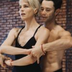 Selma Blair Instagram - Oh the places I’ve been! But I never considered I would be in a dance rehearsal space for a live @disneyplus ballroom dance show. And I loved every single second of it. Having an “atta girl” from so many people in my life and on here and in the @dancingwiththestars 🪩 world has changed me for the better. And always to @sashafarber1 for being my first and only partner. All love. 💜 thank you @arttavee for always holding me in frame as well. I love you 📷 Series of images of Selma and Sasha in both color and black and white in a dance studio. Selma has short blonde hair and is wearing a black bodysuit. Sasha has short dark hair and is wearing a striped shirt in some images and no shirt in others. Selma’s dog Scout is in the third image on the right in the photo.