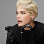 Selma Blair Instagram - “In the meantime, I took a job folding T-shirts at the Gap on Seventy-Fifth and Lex. I loved folding clothes on the folding board. I loved the Gap pens we won if we sold the most product that day. I loved the employee discount and the tap of the register keys as I printed out gift certificates and ran exchanges. In a way, working at the Gap was the perfect job for me, a place to channel my deep need for organization.” — Excerpt from Mean Baby Image one: Selma has short blonde hair, is wearing a black shirt and is resting her chin on the handle of her cane looking off to the right. Image two: Selma has short blonde hair, is wearing a black shirt and holding her cane in her right hand as her whole body is facing right. Image three: Selma is wearing black jeans, shirt and shoes while she is jumping above her cane, which she is holding in her right hand. Image four: Selma is on set wearing a jacket. Her right knee is bent as she looks directly at the camera. Image five: Selma is seated and looking directly at the camera while she leans on her cane. Image six: Written text from Mean Baby.