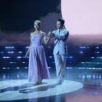 Selma Blair Instagram - About last night…💜 And all the love to @sashafarber1 and my crew of greats✨ IMAGE 1: Selma has short blonde hair and is being lead downstage into the spotlight by her partner Sasha who has short brown hair and is wearing a lavender suit. IMAGE 2 : Selma has short blonde hair and is seated in a chair in wearing a long lavender dress while she looks to the left and holds hands with Amy, who has dark blonde hair and is wearing black pants and a black top. IMAGE 3: Selma stands in a lavender dress with her friends Jamie, Andraéa, Hylda, her son Arthur and Jason. IMAGE 4: Selma has short blond hair and is standing with her arm around her son Arthur, who is wearing a navy jacket. IMAGE 5 - Selma and Sasha hug on stage at the end of their performance.
