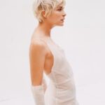 Selma Blair Instagram - “I was overwhelmed by a sense of relief,” recalling the moment I found out about my MS, “like the way you feel when an ocean wave breaks right at the shore before taking you under.” @SELFmagazine cover story is out now. 🤍 Thank you to this brilliant team — SELF: @selfmagazine Photography: @heatherhazzan  Wardrobe styling: @seanknight Hair: @bridgetbragerhair Makeup: @karayoshimotobua Manicure: @ashlie_johnson  Profile: @emmacargo   Creative Director: @avenerable  Entertainment Directors: @cbroday & @sergiokletnoy Image Descriptions: 1. Selma has short blonde hair and is seated holding her hands in front of her wearing a green dress and gloves. The text SELF and Spotlight in Selma appear on image. 2. Selma is standing in profile wearing a white dress and gloves. 3. Selma’s face appears in the middle of the red fabric of her dress. 4. Polaroid of Selma wearing black tank top with feathers while punching towards the camera. 5. Series of 8 images of Selma seated in red dress on pink couch. 6. Selma is wearing the black top and jeans while winking. 7. Black and white image of Selma in white dress and gloves with her signature and a heart on image. She is slightly bent and smiling.