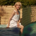 Selma Blair Instagram - So many places to be alone, so many escapes. So many summers that we can keep—if we want to—for ourselves, keep forever. And we had better. - Joan Didion, American Summer. 📸 @raulromo [Image Description: A series of photographs of Selma, with short blonde hair in a white dress in and around a pool with her dog Scout. She is using her blue cane from @neowalksticks.]