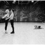 Selma Blair Instagram - Oh the places I’ve been! But I never considered I would be in a dance rehearsal space for a live @disneyplus ballroom dance show. And I loved every single second of it. Having an “atta girl” from so many people in my life and on here and in the @dancingwiththestars 🪩 world has changed me for the better. And always to @sashafarber1 for being my first and only partner. All love. 💜 thank you @arttavee for always holding me in frame as well. I love you 📷 Series of images of Selma and Sasha in both color and black and white in a dance studio. Selma has short blonde hair and is wearing a black bodysuit. Sasha has short dark hair and is wearing a striped shirt in some images and no shirt in others. Selma’s dog Scout is in the third image on the right in the photo.