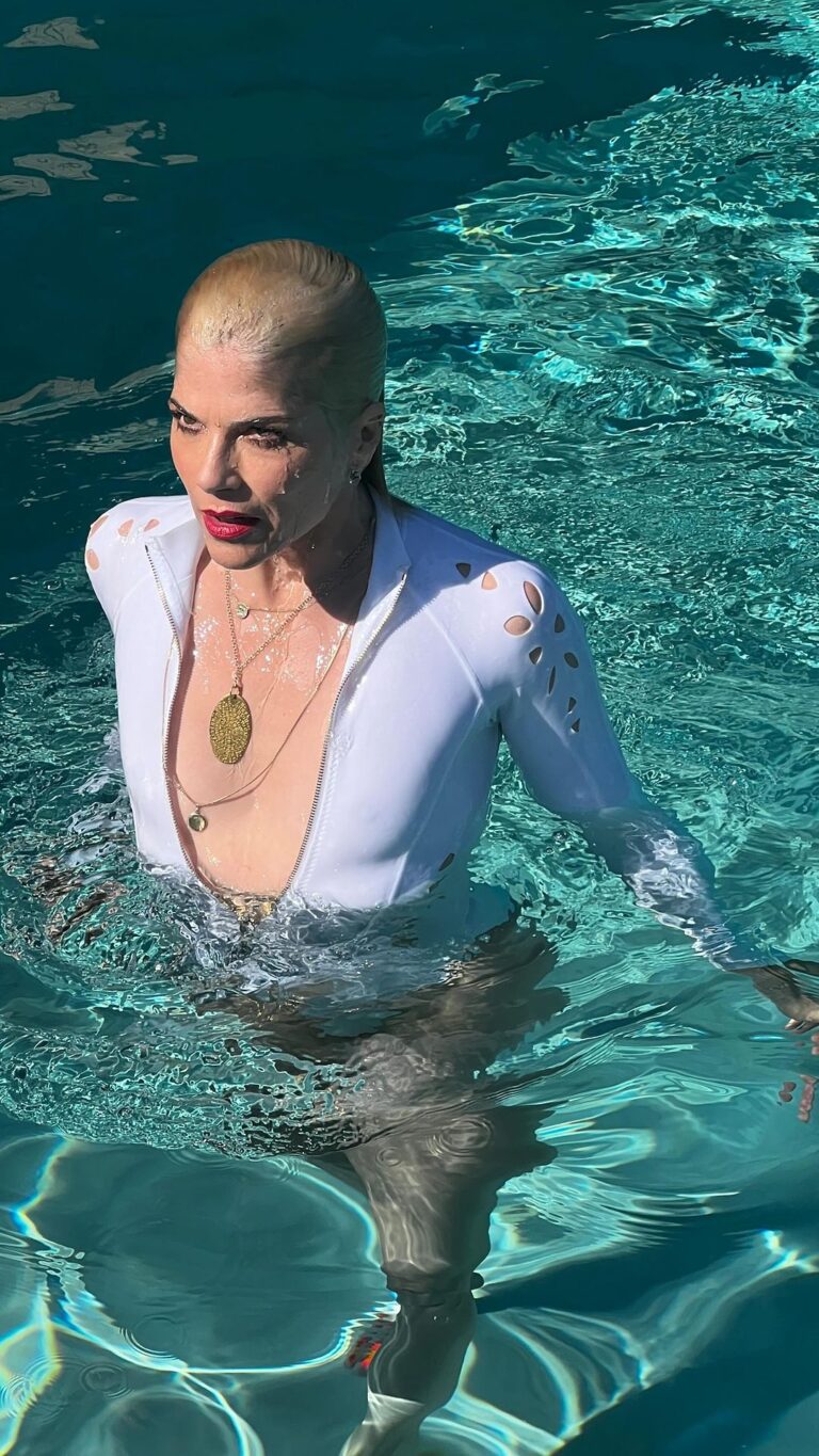 Selma Blair Instagram - Mad about you 💋 [Video Description: Selma has bleached blonde hair and is wearing a white bathing suit while in and around a pool with her dog Scout.]