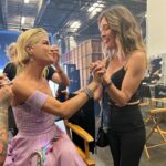 Selma Blair Instagram - About last night…💜 And all the love to @sashafarber1 and my crew of greats✨ IMAGE 1: Selma has short blonde hair and is being lead downstage into the spotlight by her partner Sasha who has short brown hair and is wearing a lavender suit. IMAGE 2 : Selma has short blonde hair and is seated in a chair in wearing a long lavender dress while she looks to the left and holds hands with Amy, who has dark blonde hair and is wearing black pants and a black top. IMAGE 3: Selma stands in a lavender dress with her friends Jamie, Andraéa, Hylda, her son Arthur and Jason. IMAGE 4: Selma has short blond hair and is standing with her arm around her son Arthur, who is wearing a navy jacket. IMAGE 5 - Selma and Sasha hug on stage at the end of their performance.