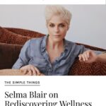 Selma Blair Instagram - Thank you @coveteur for highlighting my wellness journey 🤍 link in Stories Image 1: Selma has short blonde hair and is wearing a shiny black and bronze striped jacket. She has her hands lifted over head and face angled towards the camera, looking down. Her eye shadow is bronze and black. Image 2: Selma has short blonde hair and looks into a mirror as she holds a makeup tool for eyebrows from Guide Beauty Cosmetics. She wears a large emerald ring. Image 3: A headline from the Coveteur reads, “Selma Blair on Rediscovering Wellness Rituals That Work For Her.” Selma is quoted “now that I have cleared up some lost energy, I have the patience to witness my own imbalances.” Selma is shown sitting on a couch looking direct to camera.