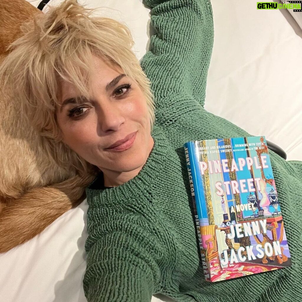 Selma Blair Instagram - New York Times best seller 📚 @jennyjacksonpineapple! Not only do you have the rare ability to edit the greats, myself included, but you can create the perfect generational east coast Rich Family story that we all love. So witty and lively and gorgeously written. Congratulations I love you!!! 💛🍍 Image Descriptions: Image 1: Selma has short blonde hair and is wearing a green sweater. She is laying in bed in her back holding the book Pineapple Street on her chest. Image two: Selma is bald and is standing on the left wearing a black jacket looking at Jenny Jackson, who has long blonde hair and is also wearing black. Image three: Selma stands in the middle of a group of five people. Image four: The New York Times Best Seller list. Pineapple Street is listed at number 5 and highlighted in purple.