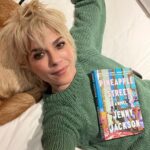 Selma Blair Instagram - New York Times best seller 📚 @jennyjacksonpineapple! Not only do you have the rare ability to edit the greats, myself included, but you can create the perfect generational east coast Rich Family story that we all love. So witty and lively and gorgeously written. Congratulations I love you!!! 💛🍍 Image Descriptions: Image 1: Selma has short blonde hair and is wearing a green sweater. She is laying in bed in her back holding the book Pineapple Street on her chest. Image two: Selma is bald and is standing on the left wearing a black jacket looking at Jenny Jackson, who has long blonde hair and is also wearing black. Image three: Selma stands in the middle of a group of five people. Image four: The New York Times Best Seller list. Pineapple Street is listed at number 5 and highlighted in purple.