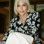 Selma Blair Instagram - NYC. Friday night. Room service. 💛 Image Descriptions: 1) Selma with short blonde hair wearing a black and white floral PJ set, standing in a hotel bathroom and posing for the camera. 2) Selma standing on the bed with one leg up and both arms up. 3) Selma sitting on the bed and looking at the camera. 4) Selma midair with her legs crossed and hands up, looking to the side. 5) black and white photo of Selma kneeling next to Scout and smiling at the camera as he licks her face.