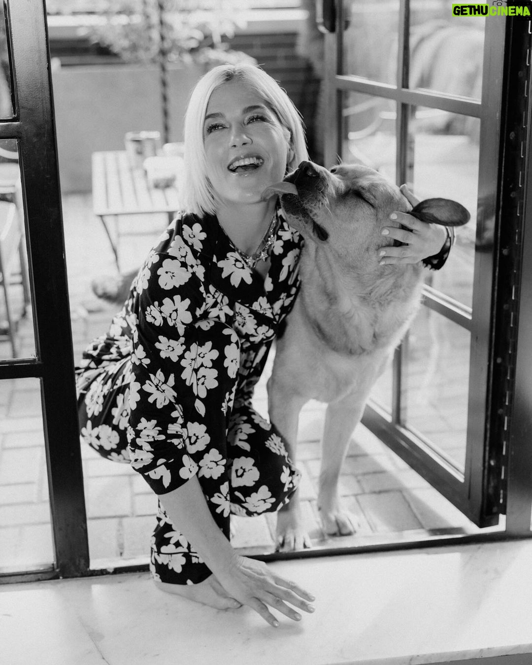 Selma Blair Instagram - NYC. Friday night. Room service. π Image Descriptions: 1) Selma with short blonde hair wearing a black and white floral PJ set, standing in a hotel bathroom and posing for the camera. 2) Selma standing on the bed with one leg up and both arms up. 3) Selma sitting on the bed and looking at the camera. 4) Selma midair with her legs crossed and hands up, looking to the side. 5) black and white photo of Selma kneeling next to Scout and smiling at the camera as he licks her face.