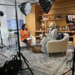 Selma Blair Instagram - I am honored and privileged to have been interviewed by @kristen.welker for @meetthepress on NBC. Watch the full interview — link in Stories. Descriptions: 1) Selma wears a white suit and uses a clear lucite cane, sitting next to Kristen Welker, wearing an orange jacket and black skirt. They are sitting next to each other and smiling at the camera. 2) Selma speaks to Kristen in an interview. 3 and 4) behind the scenes of Selma and Kristen sitting in a living room for the interview, with equipment around them. 5) Selma with no makeup and wearing glasses, holds a “Meet The Press” mug.