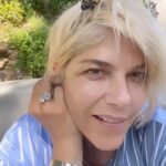 Selma Blair Instagram - I have assigned meaning before their due, searching past reason. But I believe in Transformation. And the reality of the butterfly. And that it has kept me company all afternoon. And still even now. Things are changing 👸 [Image and Video Descriptions: 1. Selma has short blonde hair and has a butterfly covering one eye. 2. The butterfly rests on the back of Selma’s head. 3. Video of Selma outside wearing a blue shirt with white stripes while speaking to the camera with a butterfly on her head.]