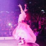 Shania Twain Instagram - We were ROCKIN’ in Buffalo 💥 I took inspiration from some of my favorite female punk rockers for my show outfit - @benatargiraldo, @blondieofficial, @heartofficial… edgy femininity. I just love the contrast of the pink tutu against the boots! Plus jumping around onstage is much easier in docs than heels!! 😂 Buffalo, New York