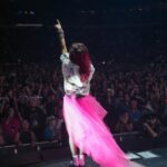 Shania Twain Instagram - We were ROCKIN’ in Buffalo 💥 I took inspiration from some of my favorite female punk rockers for my show outfit - @benatargiraldo, @blondieofficial, @heartofficial… edgy femininity. I just love the contrast of the pink tutu against the boots! Plus jumping around onstage is much easier in docs than heels!! 😂 Buffalo, New York