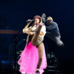 Shania Twain Instagram - We were ROCKIN’ in Buffalo 💥 I took inspiration from some of my favorite female punk rockers for my show outfit - @benatargiraldo, @blondieofficial, @heartofficial… edgy femininity. I just love the contrast of the pink tutu against the boots! Plus jumping around onstage is much easier in docs than heels!! 😂 Buffalo, New York