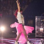 Shania Twain Instagram - We were ROCKIN’ in Buffalo 💥 I took inspiration from some of my favorite female punk rockers for my show outfit - @benatargiraldo, @blondieofficial, @heartofficial… edgy femininity. I just love the contrast of the pink tutu against the boots! Plus jumping around onstage is much easier in docs than heels!! 😂 Buffalo, New York
