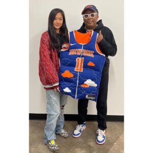 Spike Lee Instagram - Shout To Artist Jocelyn Hu For Designing This HYPED,DOPE JALEN BRUNSON NY KNICKS Jersey/Vest. I Will Be Rockin’ This Tonight Courtside (Where Else😂) At Da Garden Debut Of Sensation VICTOR WEMBANYAMA.HISTORIC NIGHT At Da Worlds’ Most Famous Arena. ORANGE AND BLUE SKIES🏀🏀🏀