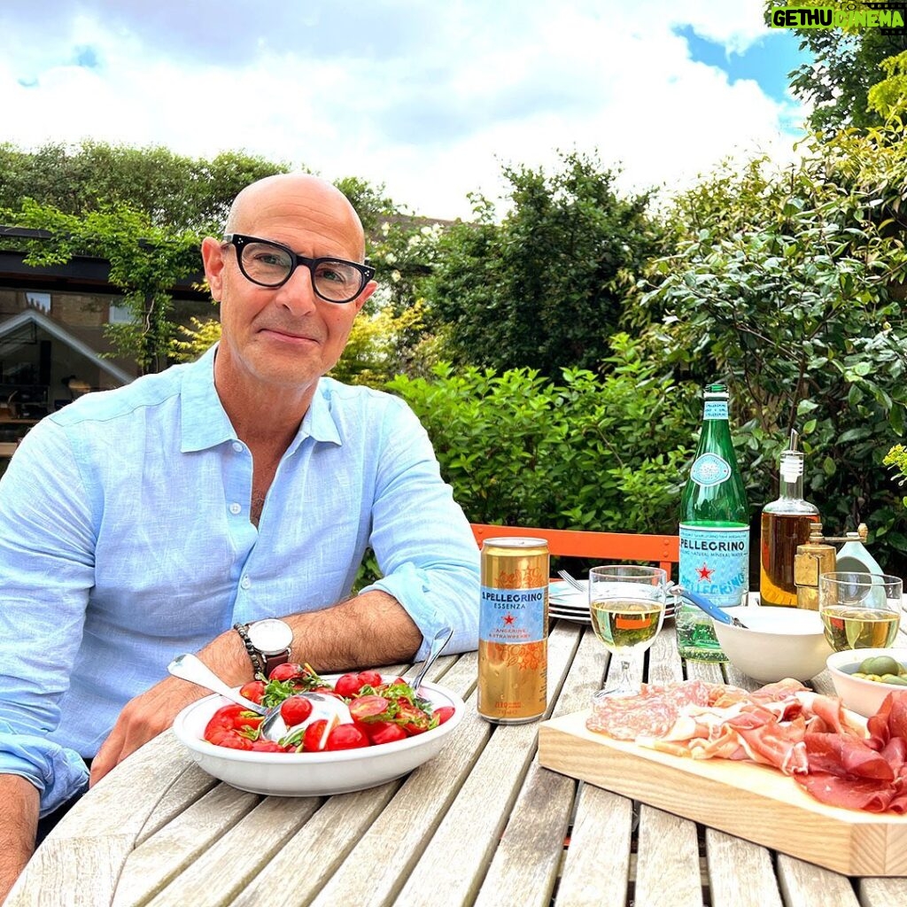 Stanley Tucci Instagram - Summer like an Italian… Dine outside, cook with seasonal ingredients, and enjoy a glass of S.Pellegrino (and wine) at lunch. ⠀ ⠀ @sanpellegrino_us and I are giving you a chance to embrace the Italian way of life this summer. For official rules and to enter, visit the link in today’s stories. ⠀ #sanpellegrinopartner #sanpellegrino #sanpellegrinosummer