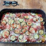 Stanley Tucci Instagram - Road tripping to Cornwall today and we packed the Tucci eggplant parmigiana for lunch! ⠀ Recipe below⠀ ⠀ • 1 medium size eggplant, cut into 1/2 inch thick slices⠀ • 2 medium size zucchini, cut into 1/2 inch thick slices ⠀ • 1/2 cup olive oil ⠀ • 2 medium size all purpose potatoes, peeled and cut into 1/4 inch thick slices • 2 cups marinara sauce (see previous video for recipe!)⠀ • 1/2 cup finely grated pecorino Romano cheese ⠀ ⠀ 1. Preheat the oven broiler/grill ⠀ 2. Lightly brush both sides of the eggplant and zucchini slices with some of the olive oil, and place on a baking sheet. Place under the broiler and brown lightly on each side, about 2 minutes per side. Remove and set aside.⠀ ⠀ 3. Place about one third of the remaining olive oil in a large sauté pan set over medium - high heat. Sauté the potatoes until slightly cooked but still firm, 3 minutes on each side. ⠀ ⠀ 4. Preheat oven to 350 Fahrenheit ⠀ ⠀ 5. Cover the bottom of a large shallow dish with about 1/2 cup of the marinara sauce. Arrange a layer of eggplant slices on top of the sauce. Top the eggplant with a thin layer of marinara sauce and a sprinkling of the cheese. Layer the zucchini on top of the eggplant, followed by a layer of potato. Top with the remaining marinara sauce and cheese. ⠀ ⠀ 6. Cover and bake until the mixture is bubbling and the vegetables are tender, about 40 minutes. Remove the cover and continue baking until the vegetables are soft when pierced with a fork, about another 10 minutes. Allow the casserole to stand for 10 minutes before serving. ⠀ ⠀ ⠀ ⠀