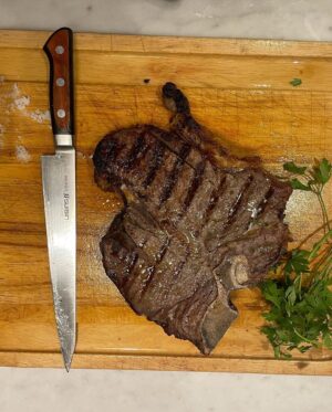Stanley Tucci Instagram - T-bone served with beans baked with a parmesan gratin. All protein. 🥩 @therock