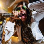 Steven Tyler Instagram - IF I HAVE ASKED IT ONCE... I HAVE ASKED IT 1,000 TIMES... DOES THE NOISE IN MY HEAD BOTHER YOU??? @aerosmith #DEUCESAREWILD 📷 @zack.whitford Live At MGM