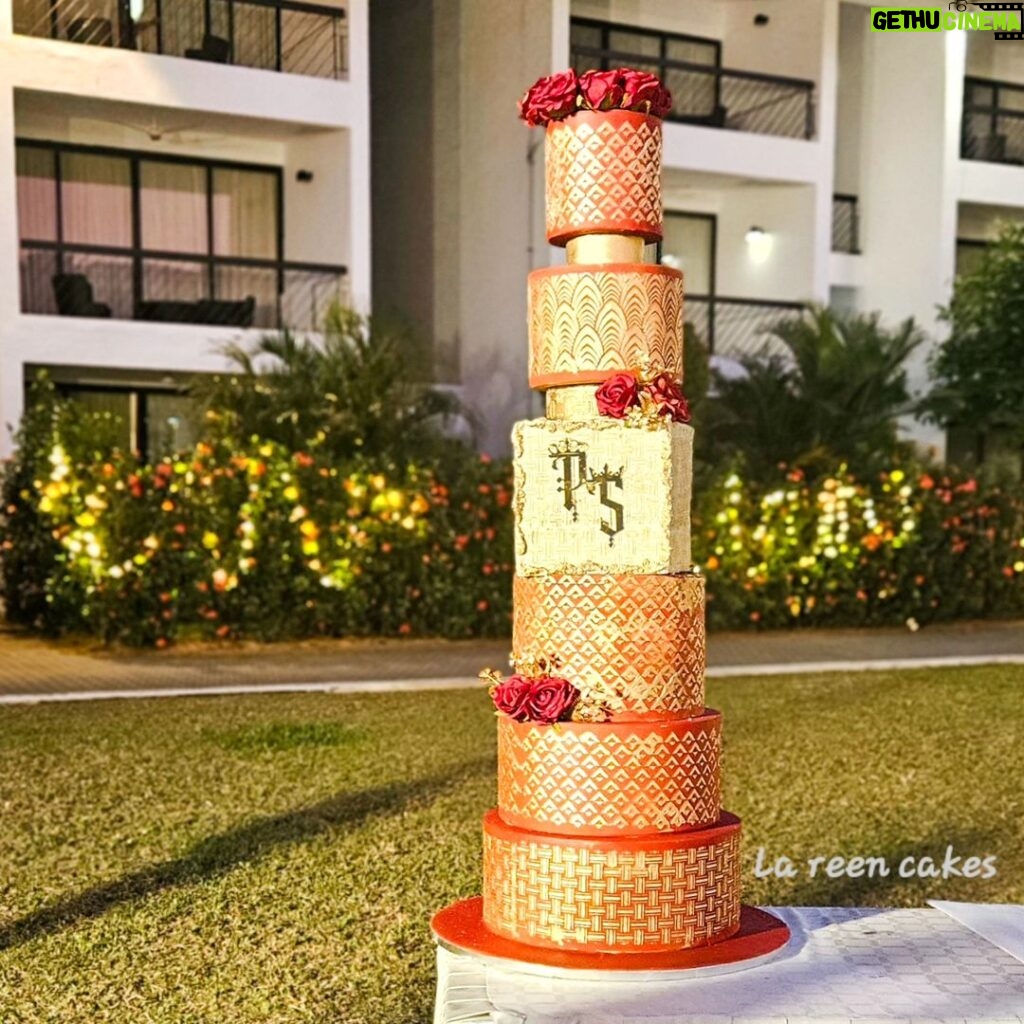Swasika Instagram - 8 tier Royal wonder for Swasika’s wedding reception When Swasika contacted me 4 months before her wedding, I had no idea that I would be making something like this for her. All she wanted was something Red, Elegant & Royal. And from there the discussions started and ended with this 8 tier beauty! The look on Swasika’s face when she saw her cake was worth all the effort I put into it… The entire cake was covered in fondant. The red colour was particularly customised and hand rolled to suit her liking. The beige square tier was a last minute addition inspired by her wedding saree blouse. Each tier was meticulously stencilled with Royal icing and hand painted gold. I added fondant accents to enhance the overall look. The entire look was completed with a custom acrylic topper that included the bride and groom’s initials and some flowers . . The cake design was inspired by @indulgencebyshazneenali and @cakestrybyfathimaiqbal wedding cakes RECCAA Club
