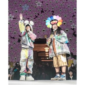 Takashi Murakami Instagram - The “Takashi Murakami Mononoke Kyoto” exhibition opened on February 2.
JP THE WAVY produced and sang the theme song, “Mononoke Kyoto”, for the exhibition. 

The reason why I asked JP THE WAVY to write the song for me was because I happened to see a group of children around second to fourth grades dancing energetically to his song “Pick N Choose” at their hip-hop dance recital. I became extremely excited, sensing that this was the long-awaited dawn of Japanese hip-hop. To draw an analogy, it seemed comparable to the dawn of Japanese rock music marked by the appearance of the band, Happy End! Whoaaaaa! 

I couldn’t sit still, so I reached out by DM-ing WAVY’s Instagram, and he responded immediately; by midnight that day, astonishingly, he was at my studio. That was toward the end of November 2023.
He started making the music at a tremendous speed, we exchanged numerous LINE messages back and forth, and I was able to attend the first recording in early December. From there, things progressed rapidly and, at the end of the year, on December 30, he completed the song.

WAVY stayed at my studio for about 8 hours during the lyric writing process and kindly picked up a lot of ideas from me. After that, I created the WAVY character as a creative response from me.

And finally, on February 2, at the opening reception that started at 6 pm, WAVY actually performed with the kid dancers, and then again at the dinner party from 8 pm, he also had his own performance.
His stage costume was made by PROLETA RE ART at the suggestion of WAVY.

You can listen to the theme song “Mononoke Kyoto” written by JP THE WAVY by scanning the QR code at the end of my exhibition. Please have a listen when you visit “Takashi Murakami Mononoke Kyoto”.

@sorry_wavy @musiclabo1998
@amkk_project @jardins.des.fleurs @azumamakoto
@proletareart @kojima_shoten
@takashimurakami_mononoke_kyoto
#kyotocitykyoceramuseumofart #kyoto #art  #TakashiMurakami #mononokekyoto

Photo by @suzukish1n
