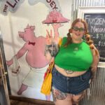 Tess Holliday Instagram - Reunited with my ancestors 🤣🐷 I’ve officially been back home for almost 3 weeks & I love Mississippi & the food, &&& love my family (even tho parts of it have been difficult)🫠 BUT ready to get back to my bed/cats/my boo 😫 Big Sip photo dump pt 1: 1) 🐽 My aunt @kathyeggers_ took me to one of her favorite college spots growing up & it didn’t disappoint (swipe for proof) 2) Post pool selfies bc I haven’t used heat on my hair since I’ve been here & the humidity has my curls lookin adorbs 3) Watching my lil brother @hunterhoven be the best uncle ever NBD 4) Bo reminding y’all to not let your cowboys grow up to be racist 👏 tee by our friends at @tatefarmstx 5) My niece & I at the most delish Indian food in Hattiesburg MS of all places?! before she goes to college for the 1st time 🤯 loved u since u were itty bitty Allyiah! @rachael_rn12 6) Proof of said food & if you don’t like pickles I don’t like you! 7) My sweet niece & Bo playing with a puppy my dad found in a ditch 😭 they named her Angel🥹 8) Branding so good I’m pissed I didn’t think of it 9) Mississippi sunsets go hard !! 10) @monopolygo is ripping my family apart but we are celebrating the tiny victories!!! Holly Springs, Mississippi