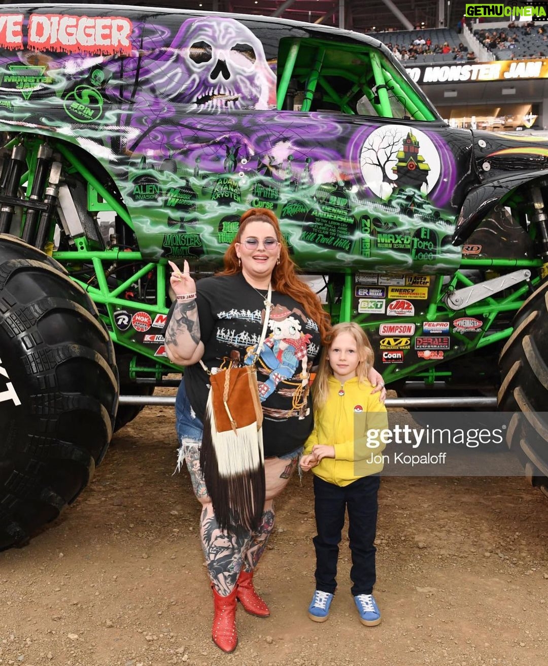 Tess Holliday Instagram - you can keep coachella, I’m a monster truck girl🤘🏻🛺🤣🛞 thank you as always to @thebillhorn & @marquecomm for making @monsterjam a tradition in our family & something we look forward to every year! I’m so glad my step mom got to experience it with us this time too & I want to publicly apologize bc she is still sad I didn’t introduce her to @sarahmgellar aka Daphne (Buffy to me🔪) 😩 hair @angelinapanelli duh tee @ebay vintage shorts @goodamerican purse @evilpork666 ❤️🩹 attitude baby jesus #monsterjam #monstertrucks #sofistadium #vintageclothing SoFi Stadium