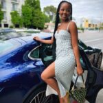Thuso Mbedu Instagram - The Flash premiere. On a new level 🚀 Dress: @reformation Necklace: @angarajewelry Bag: @prada Makeup: @makeupbyhendra Driven by: @porscheusa