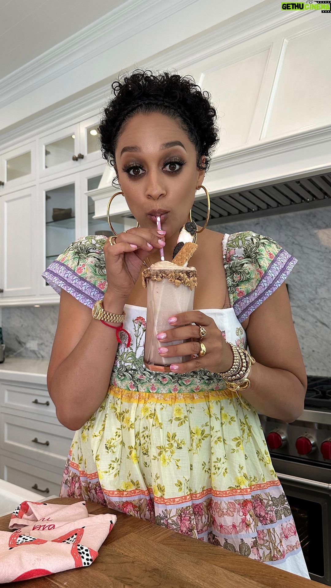 Tia Mowry Instagram - s’mores + milkshakes + bourbon = sweet summer bliss 🤤 Here is my take on this classic dessert that is sure to be a hit at your cookout! Would you try this recipe for your summer bbq? S’mores bourbon milkshake recipe, serves 2 Milkshake: 4 ounces bourbon 3 cups vanilla ice cream 1 1/2 cups whole milk 6 tablespoons chocolate fudge sauce, divided 1 tsp vanilla extract, optional Topping: Whipped cream Marshmallows 3 graham crackers, crushed Reserve 2 small pieces for garnish For Glass: Spread 1 tbsp of chocolate sauce around each rim of glass. Dip into crushed graham crackers. Have glasses ready before mixing milkshake. Place bourbon, ice cream, milk, 4 tbsps chocolate sauce and vanilla extract in a blender. Purée until combined, pour into glasses. Top with whipped cream. Over a gas range, toast marshmallow until preference. Garnish with toasted marshmallow and graham cracker. Enjoy!
