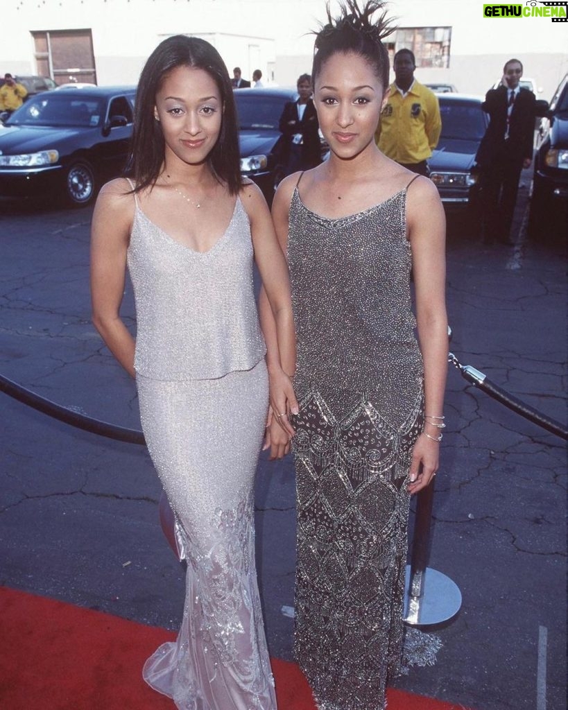 Tia Mowry Instagram - Take two on a trip down memory lane of me and @tameramowrytwo iconic 90’s red carpet looks 💅🏽Fashion is so cyclical, like the leather trench coats, the long skirts, the capris! I feel like I see outfits that are similar all the time on ig nowadays 😂 But I gotta know, which outfits are your favorite 👀