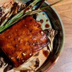 Tiffani Thiessen Instagram - It’s a Meatless Monday with this flavorful Teriyaki Tofu with Chili Crisp, Roasted Scallions and Mushrooms. #recipe on the #blog #linkinbio #vegetarian