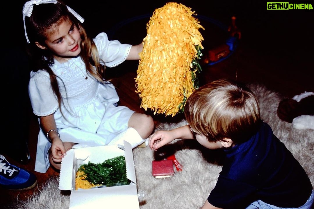 Tiffani Thiessen Instagram - #fbf Christmas morning with my little brother. Pom Poms we’re #1 on my holiday list that year. Who would have known how much they were going to be a huge part of my near future 😂