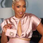 Tiffany Haddish Instagram - Look at me Looking all cute with my little @katespadeny bag. I love my Outfit that @andreaiyamah made. I am starting to think that my Glam team is full of Magicians. @waymanandmicah @ernestocasillas @hair4kicks y’all stay making magic. #sheready #tocute #katespade #andreaiyamah #tiffanyhaddish theafterparty #hauntedmansion #wakeupandmakeup